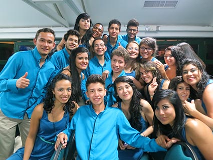 a group of young adults wearing blue