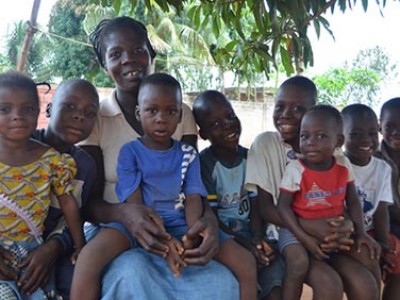 group of happy children with a caregiver