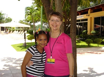 woman and girl posing for photo