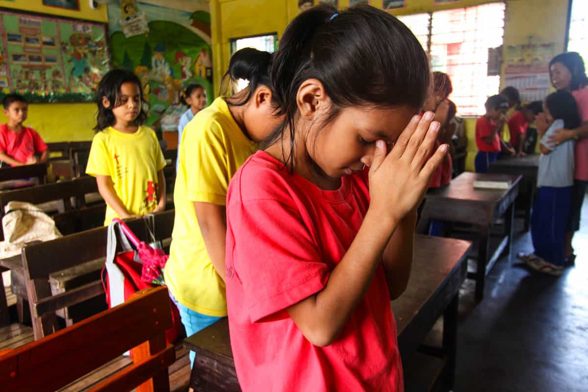 Filipino Praying In Church