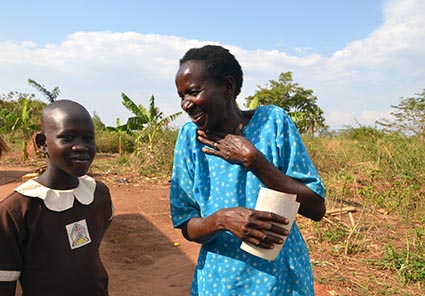 woman laughing with a young girl