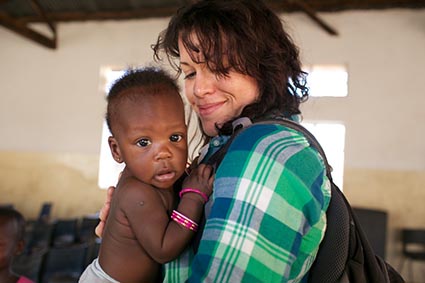 A woman holding a baby