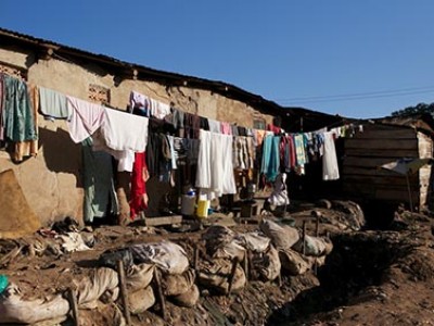 laundry drying outside on a clothesline in a slum