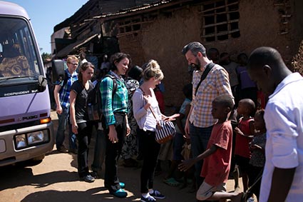 A group of people getting being greeted