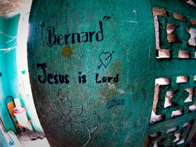 blue wall with Bernard Jesus is Lord written on it