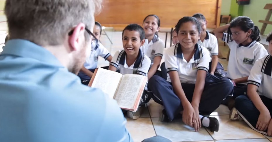 children sitting on floor listening