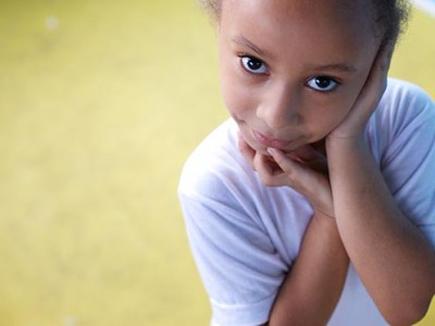 young girl with hands on face