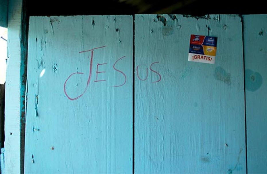 A blue wall with the word Jesus written on it