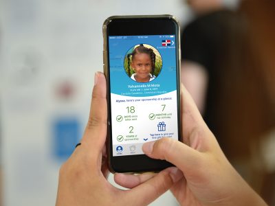 a cell phone with the compassion app on the screen