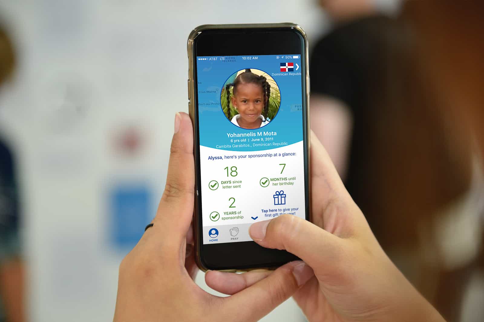 a cell phone with the compassion app on the screen