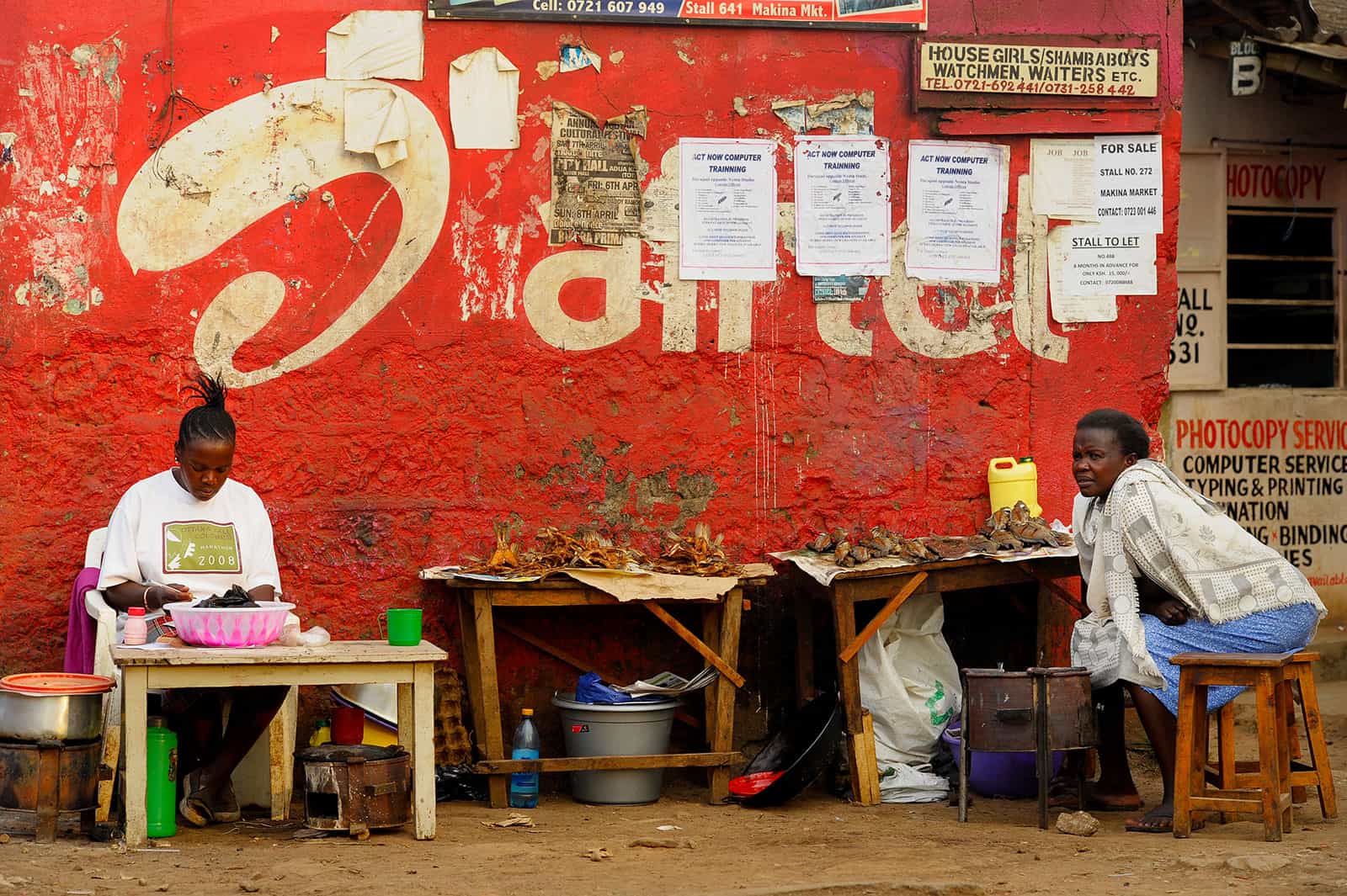 Women selling at a market in a slum know for poverty tourism