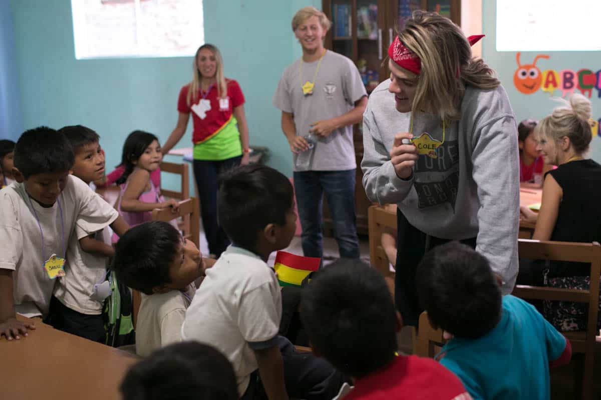 Cole LaBrant and John Grice talk to a classroom of children.