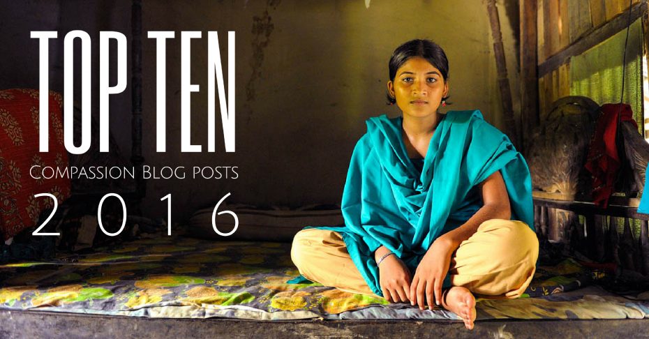 Woman sitting on mat wearing a blue shawl