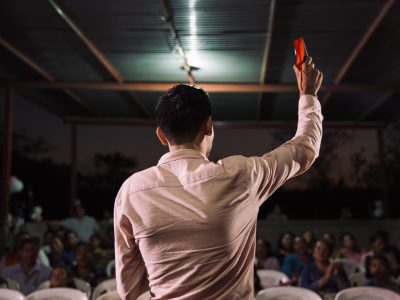 back of man with arm raised