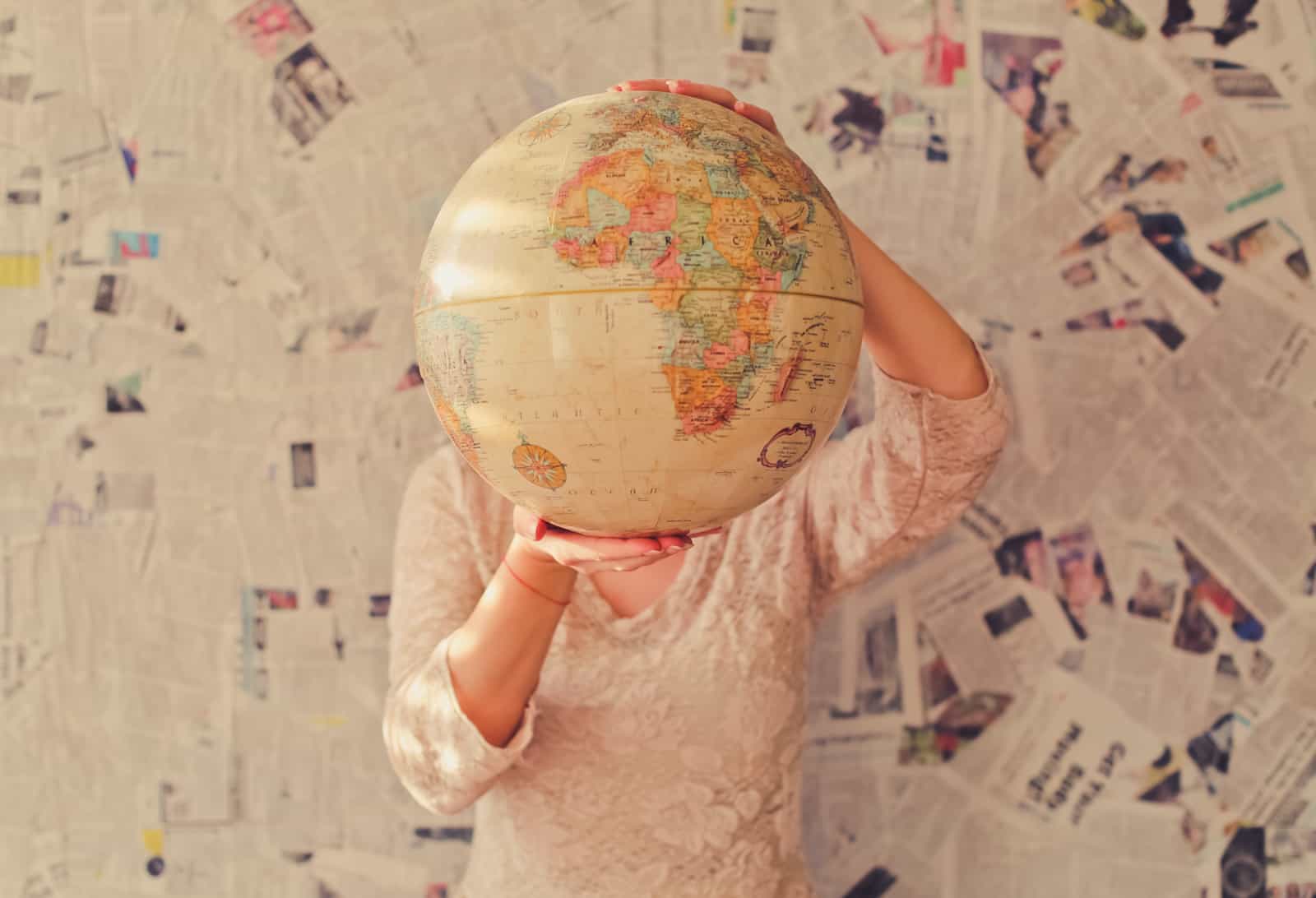 Hands holding a globe