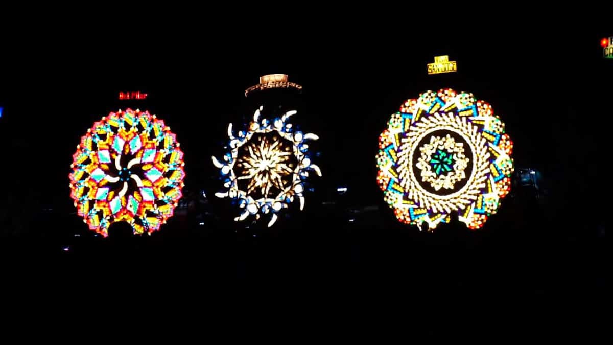 Lanterns glow against a dark background