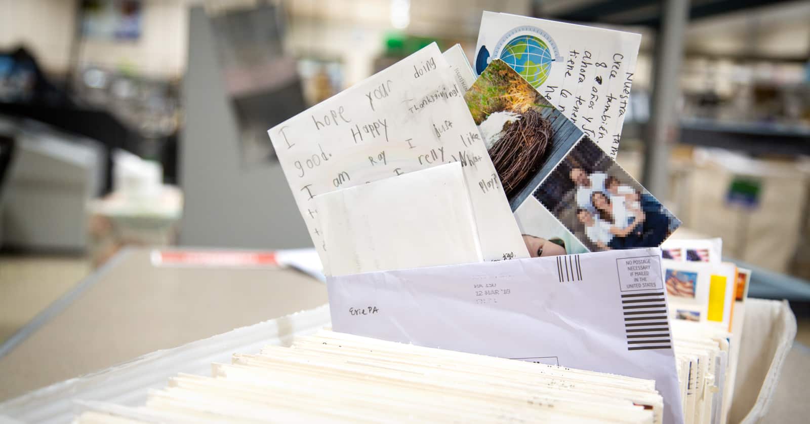 How Long Does It Take for My Letters to Be Delivered? A file folder full of letters and pictures.