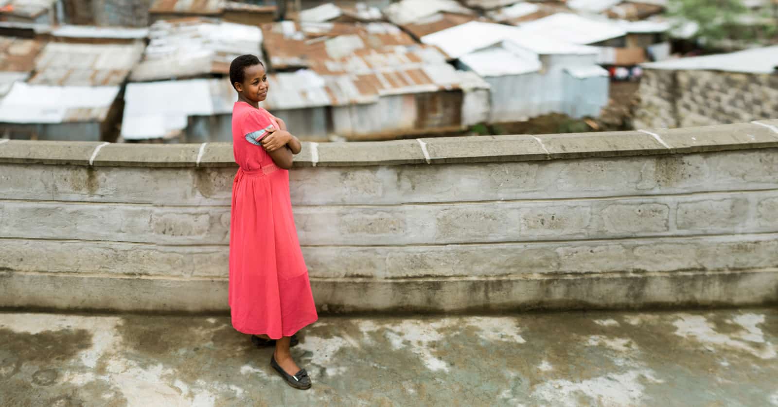 A teenage girl in a pink dress