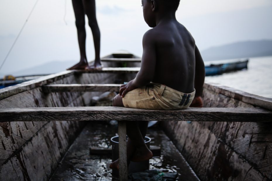 A boy sitting in a small boat