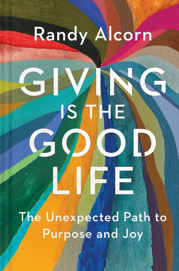 The cover of a book with a rainbow of colors that says "Giving Is the Good Life. Randy Alcorn"