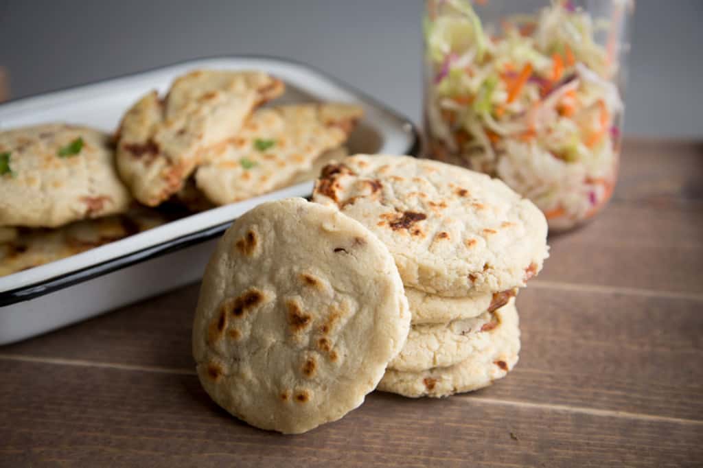 Freshly baked Salvadoran Bean and Cheese Pupusas on a table