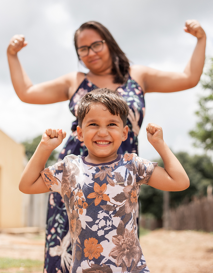 Mother and son flexing for the camera