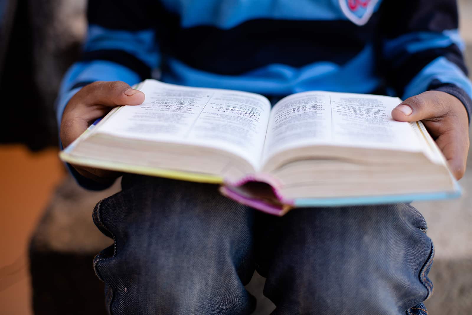 Open Bible on a child's lap