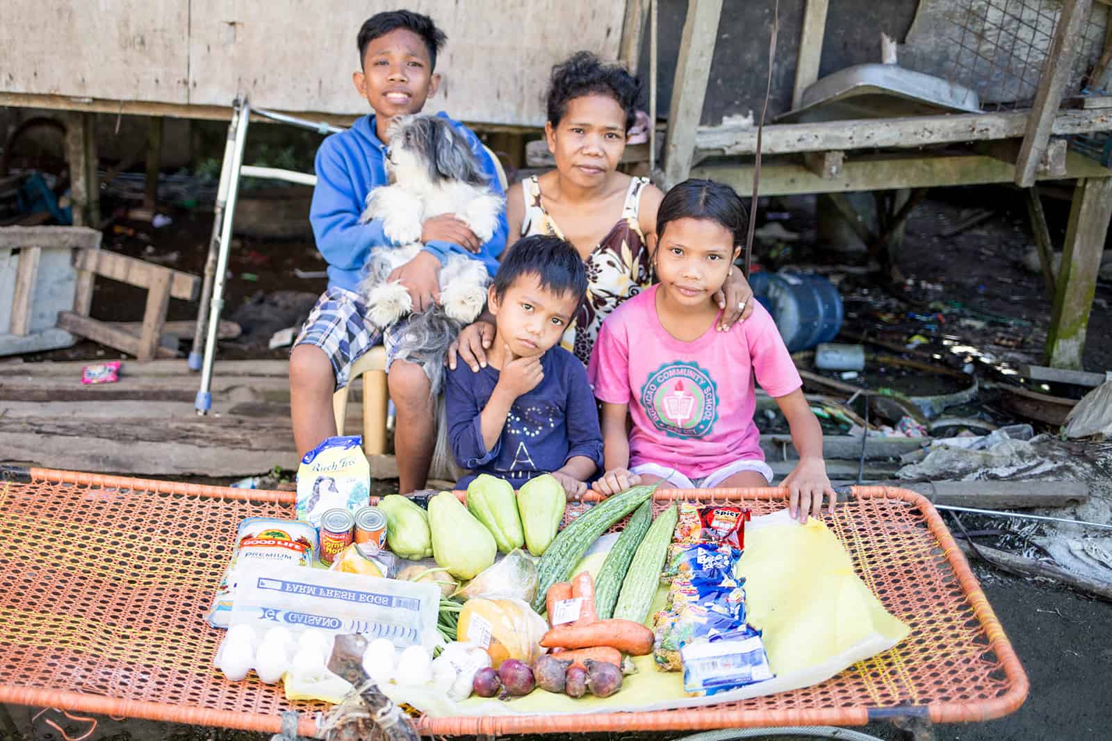 John Roque’s family posing with food