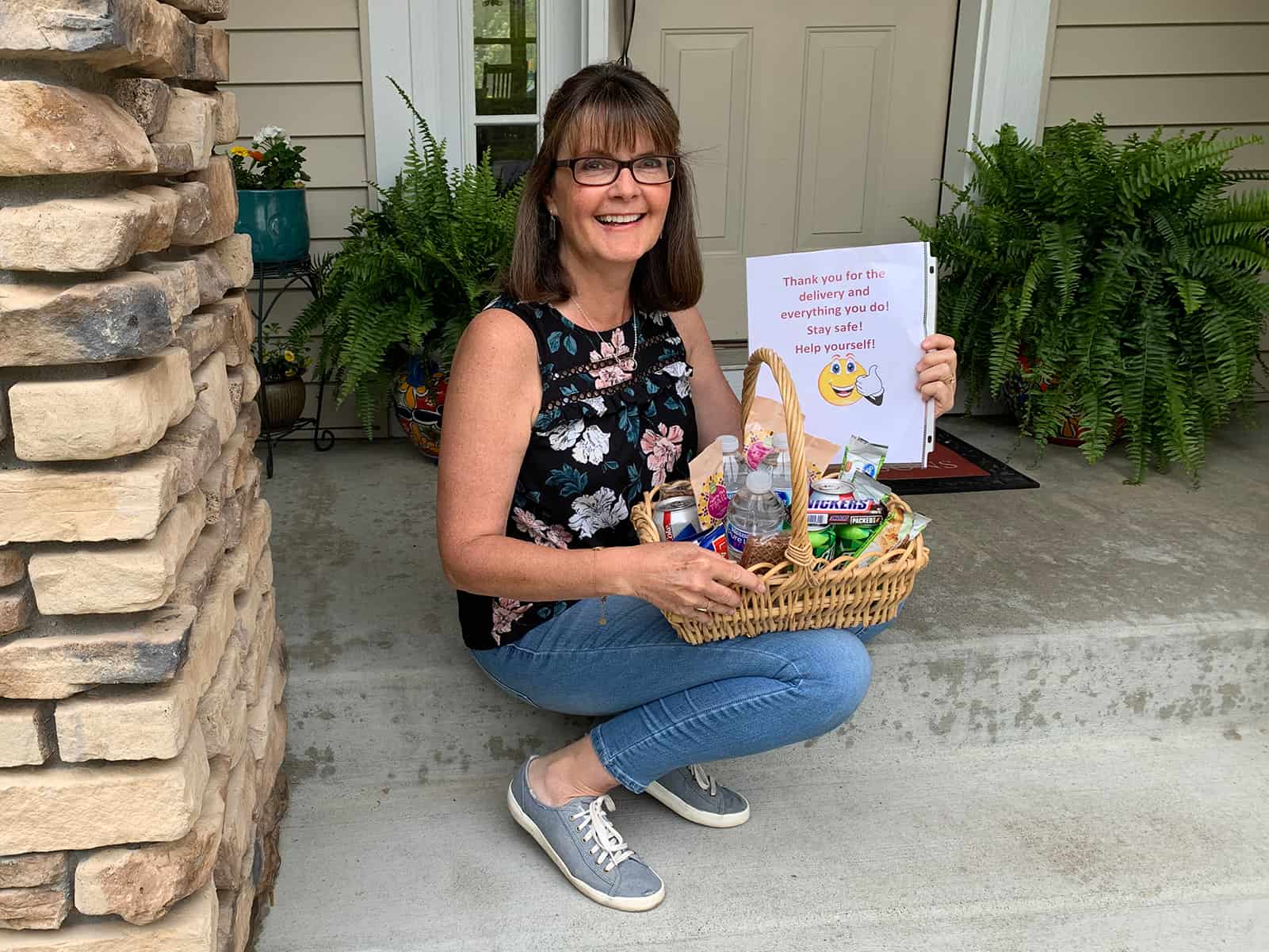 Lisa poses with one of her care baskets