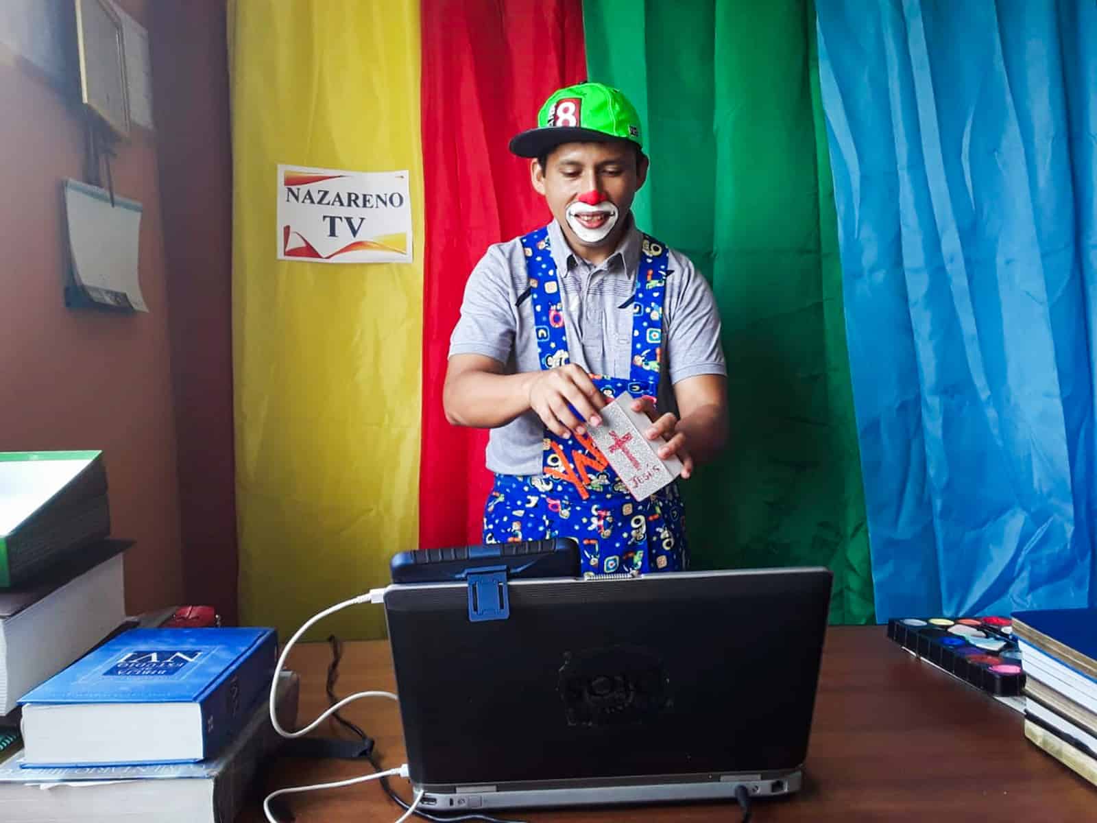 Man dressed as a clown performing for a livestream