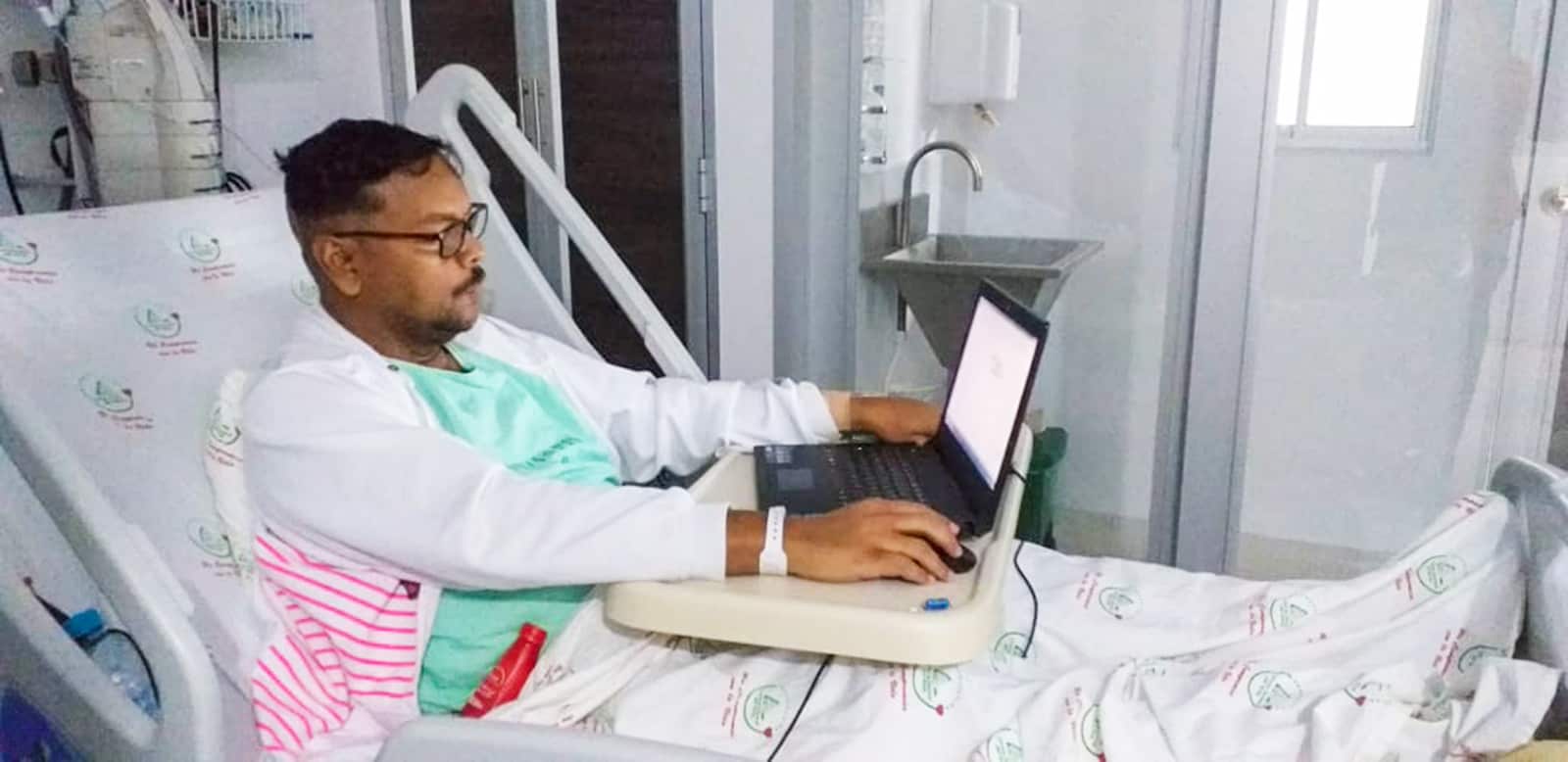 Pastor Roberto Narvaez working from his hospital bed