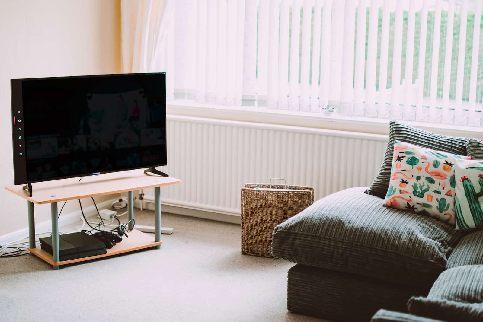 A living room with a couch and TV