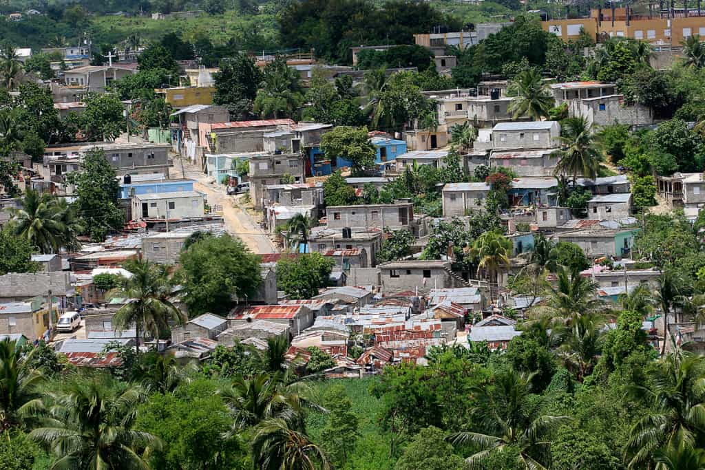 Homes are crowded together in this large neighborhood. Most are roofed with tin.