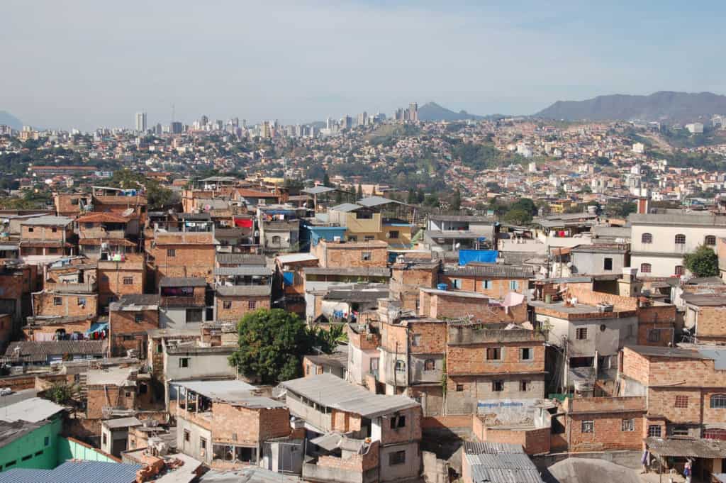 homes crowded and cluttered together built in close quarters and on top of one another in the neighborhoods.