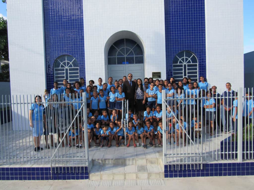Children and staff in front of a church in Brazil.