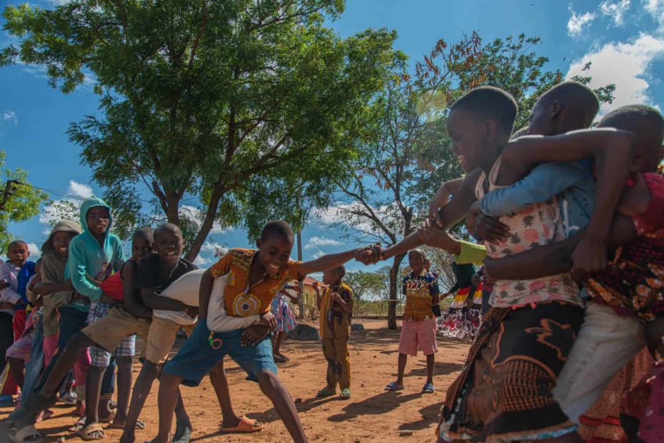 A group of children playing tug o' war