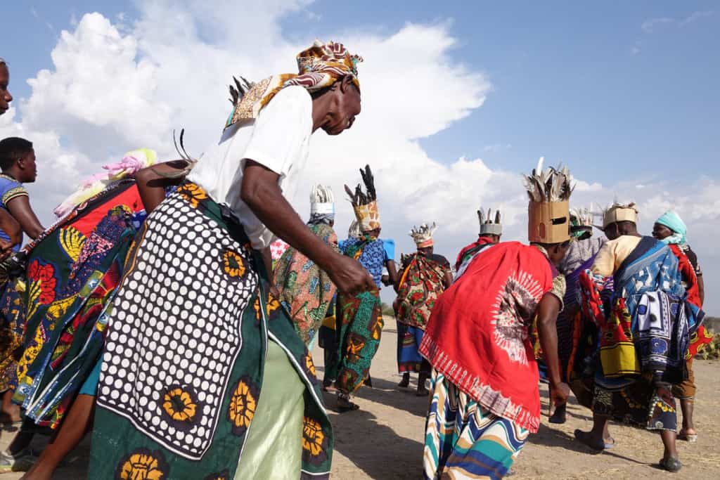 Women outside the Serengeti National Park celebrate in dance and song for a festival.