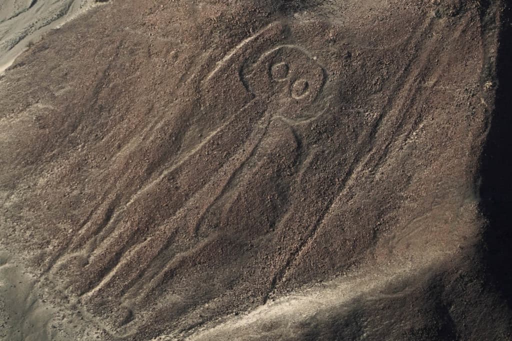 Carving in stone in Nazca, Peru