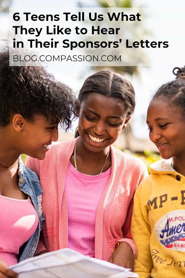 Three girls looking at a letter