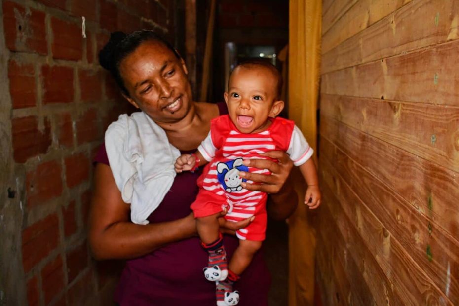 Grandmother holding her newborn grandson