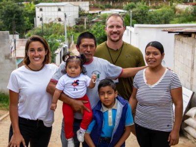 Nate Solder, his wife Lexi and a family in Guatemala