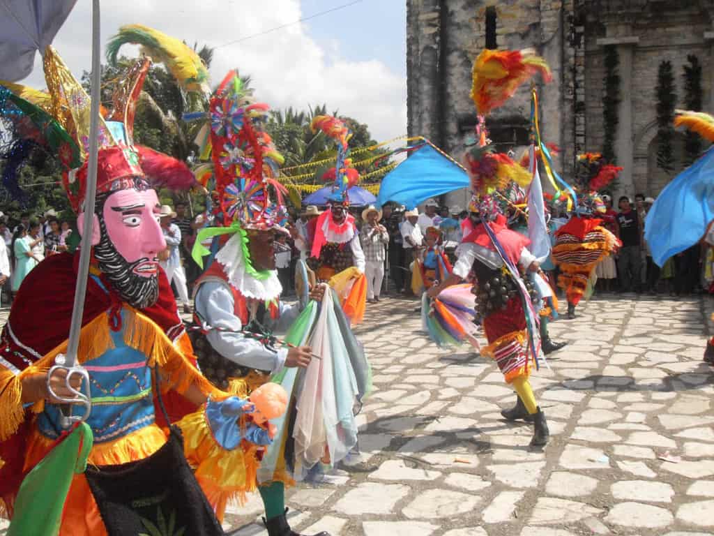 Carnival dancers in bright costumes.