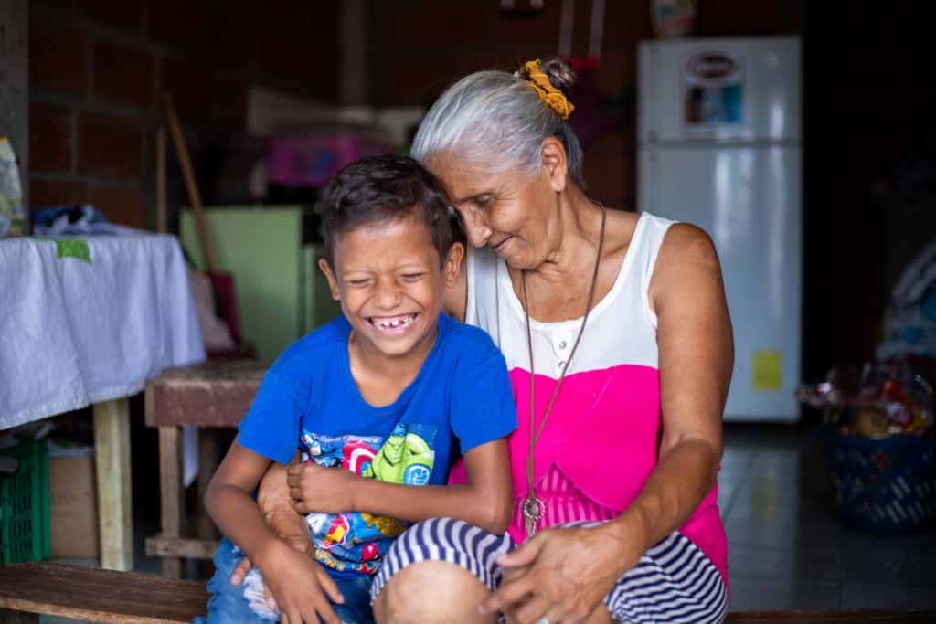 Jesus and his grandmother in their home in Ecuador