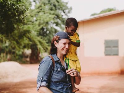 Man carrying a young boy on his shoulders