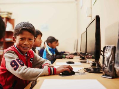 A boy uses a computer lab at his Compassion center in Bolivia.